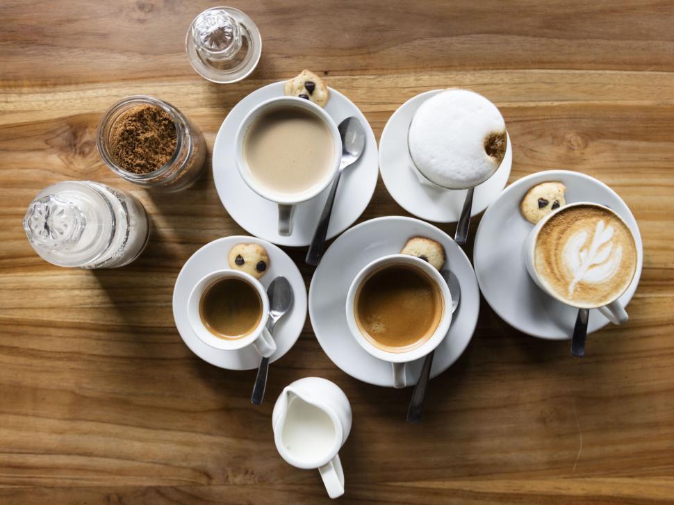 Coffee cups on a wooden board